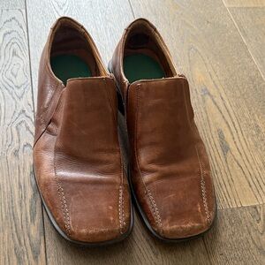 Men’s brown dress shoes.